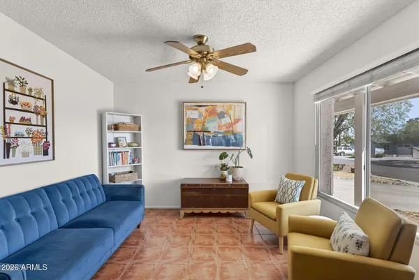 a living room with furniture and a window