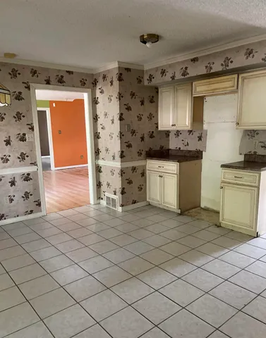 a kitchen with stainless steel appliances a sink and a refrigerator