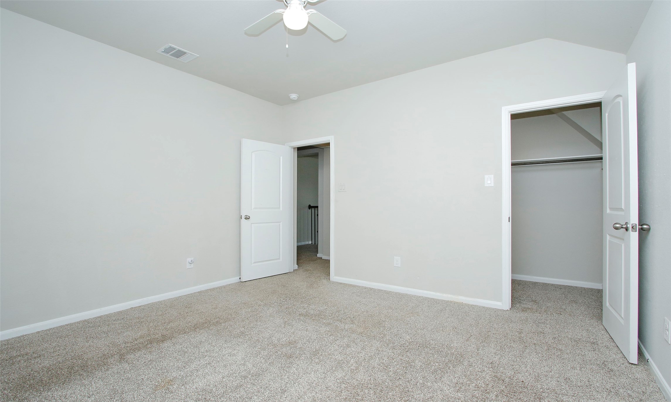 14120 Sand Ridge Court Conroe, TX 77384 - Photo 34 of 43 a view of an empty room with a chandelier fan