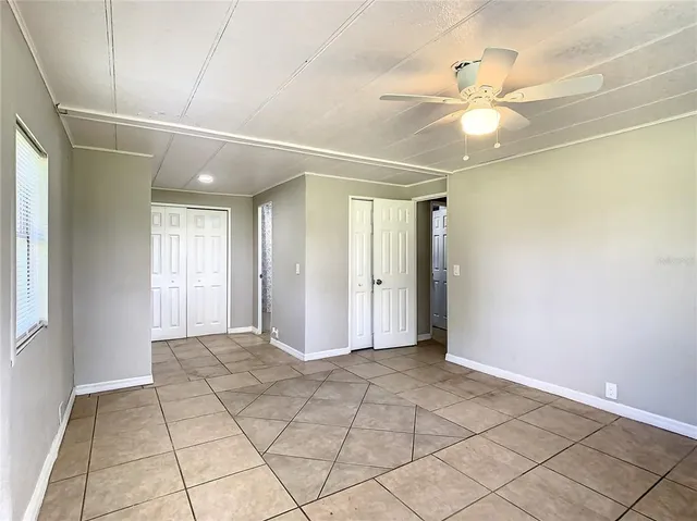 a view of an empty room with a window