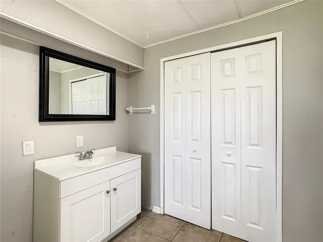 a bathroom with a toilet and a shower curtain