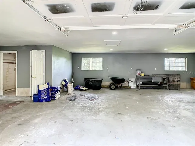 a view of a livingroom with furniture and a window