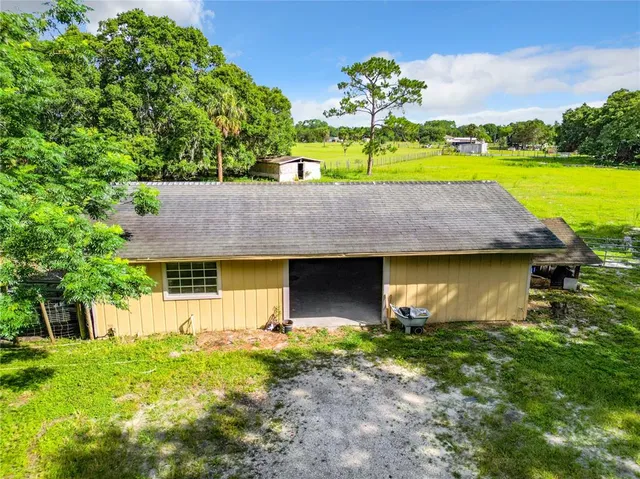 a view of a yard with swimming pool