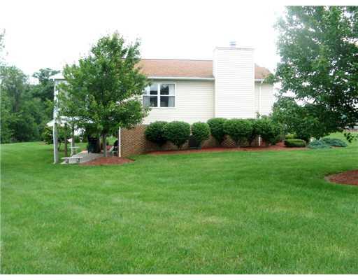 101 Spring Ridge Drive Butler, PA 16001 - Photo 17 of 18 Other. Side view of house, sunroom and side yard.