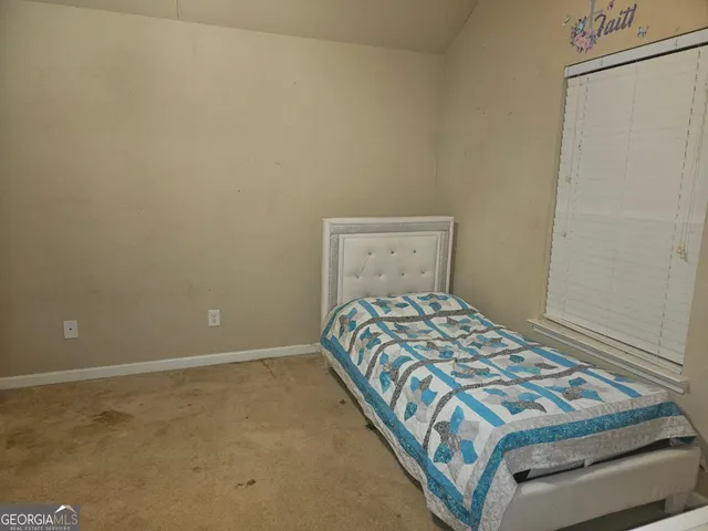 a bedroom with a bed