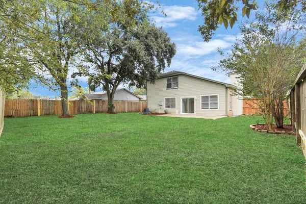 a view of a yard with a house and garden