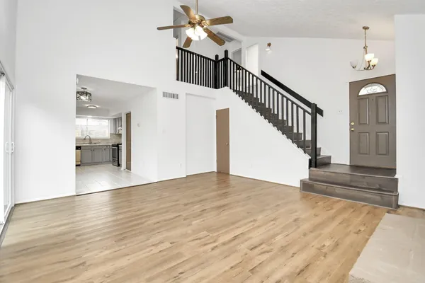 a view of an entryway and wooden floor
