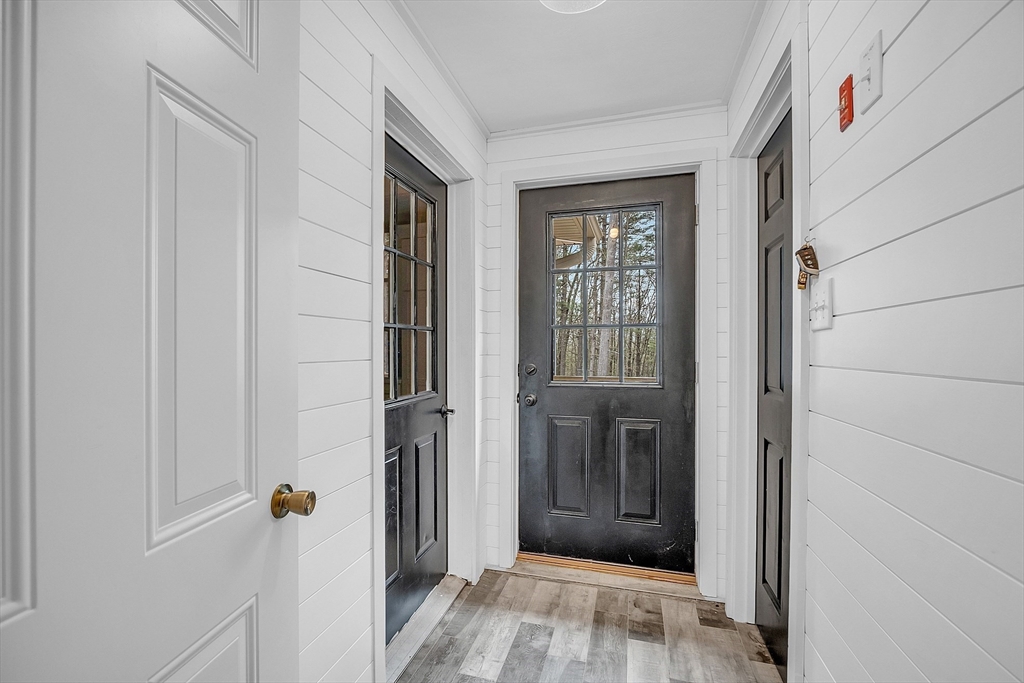 35 Bathrick Westminster, MA 01473 - Photo 13 of 36 a view of a hallway with wooden floor and closet area