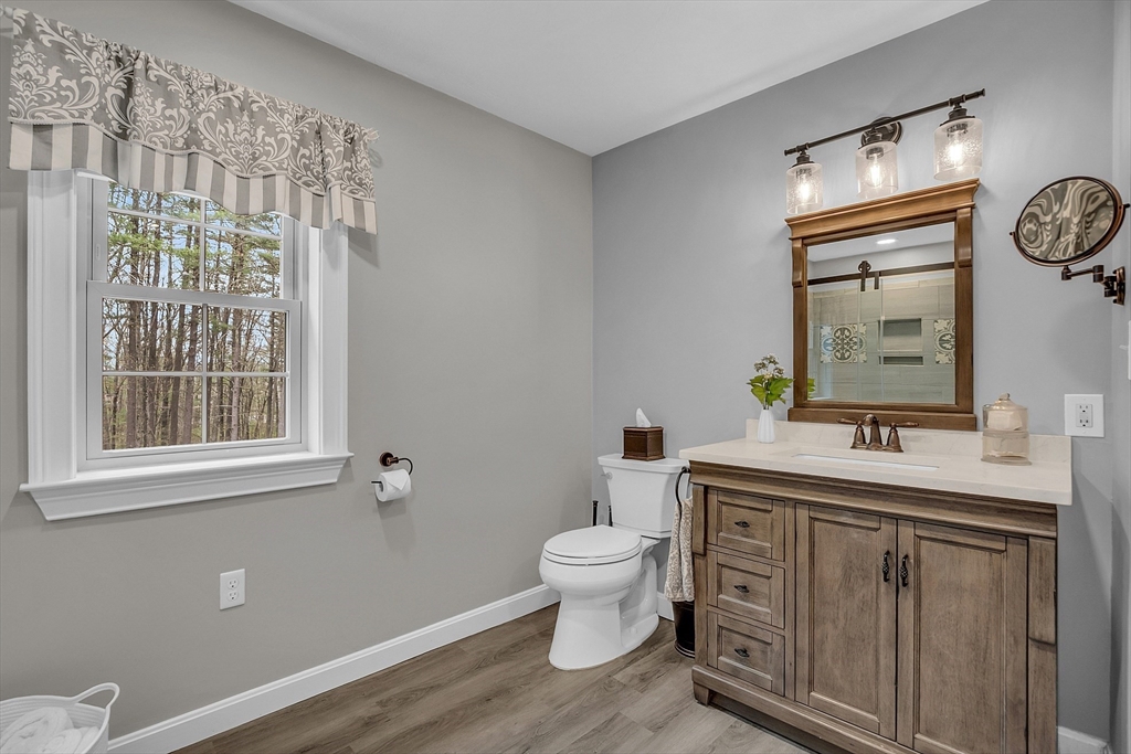 35 Bathrick Westminster, MA 01473 - Photo 15 of 36 a bathroom with a granite countertop sink toilet and mirror