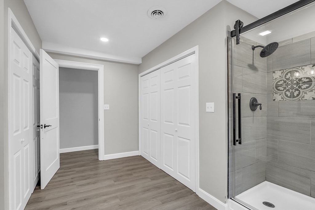 35 Bathrick Westminster, MA 01473 - Photo 16 of 36 a bathroom with a glass shower door