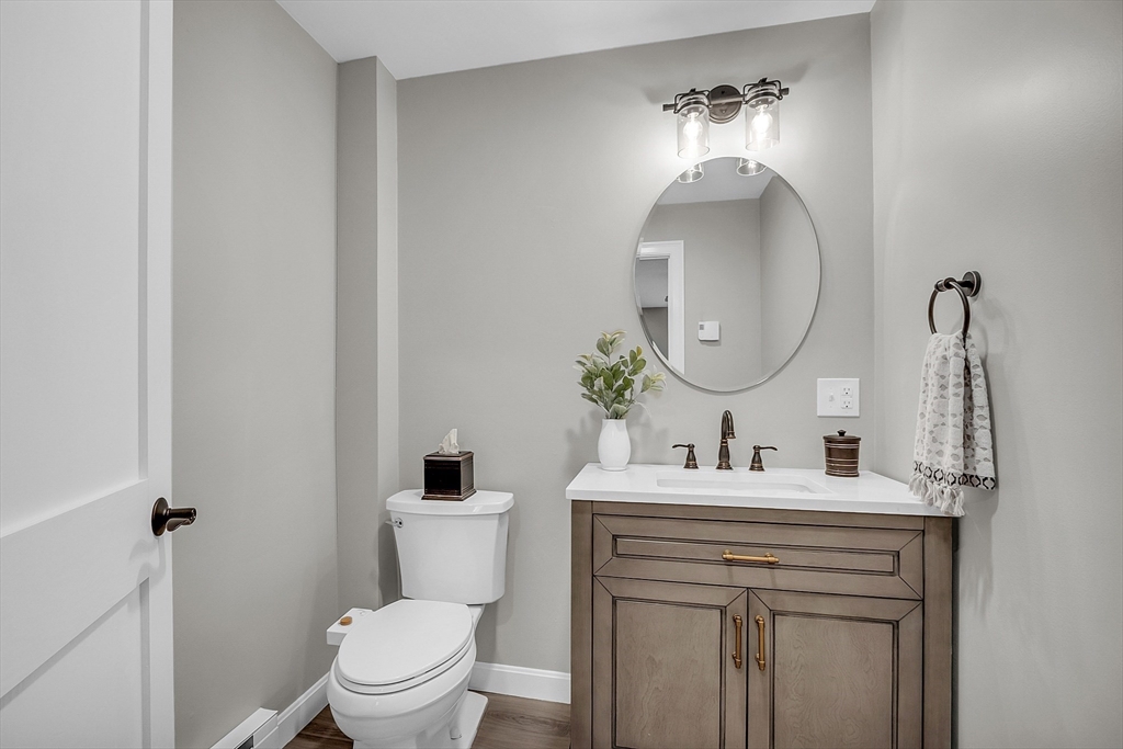 35 Bathrick Westminster, MA 01473 - Photo 23 of 36 a bathroom with a toilet sink and mirror