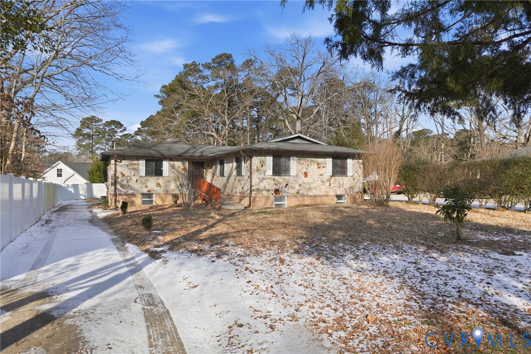 a view of a wooden house with a yard