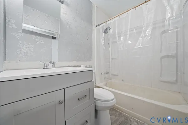 a bathroom with a sink a toilet and a bathtub