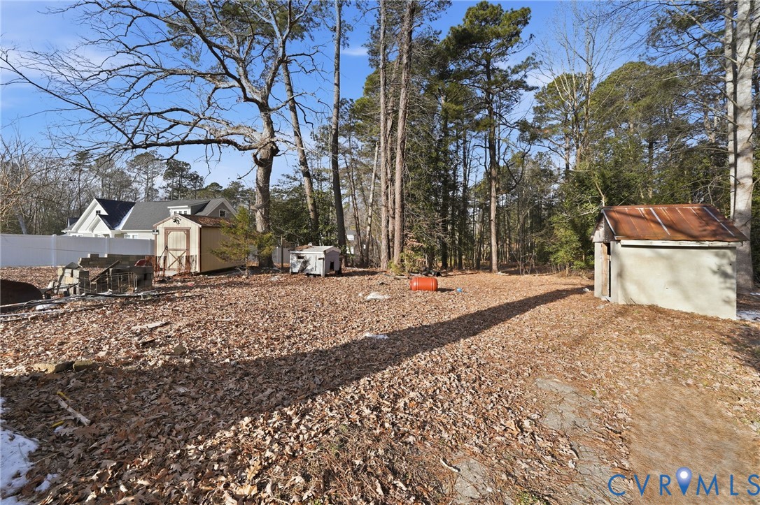 3881 Strawberry Plains Road Williamsburg, VA 23188 - Photo 23 of 29 a view of the house with a yard