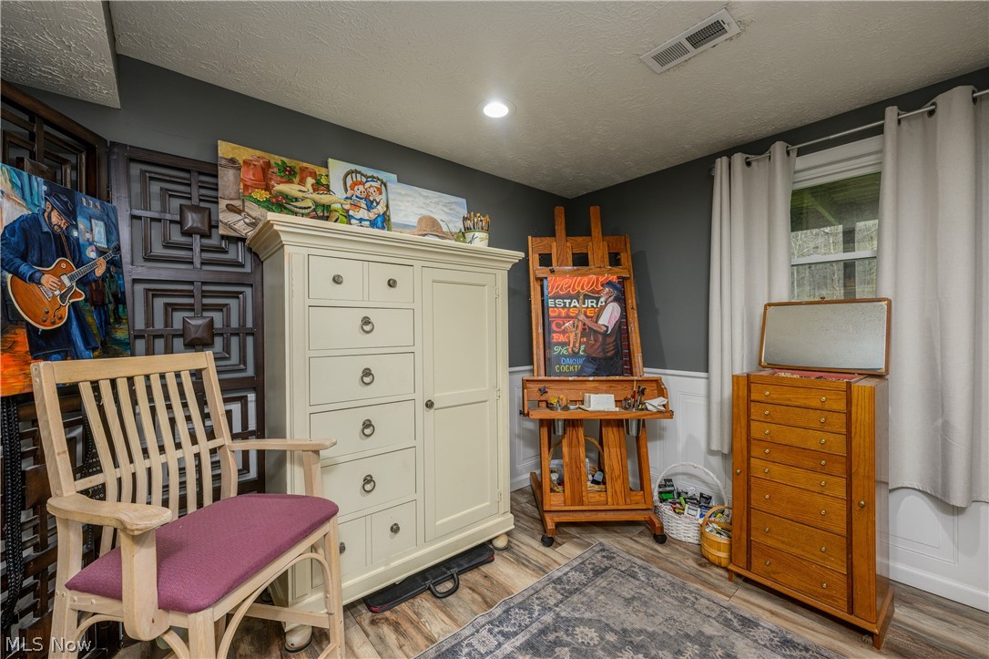 390 Ross Road Waynesburg, OH 44688 - Photo 23 of 30 Sitting room with a textured ceiling and wood finished floors