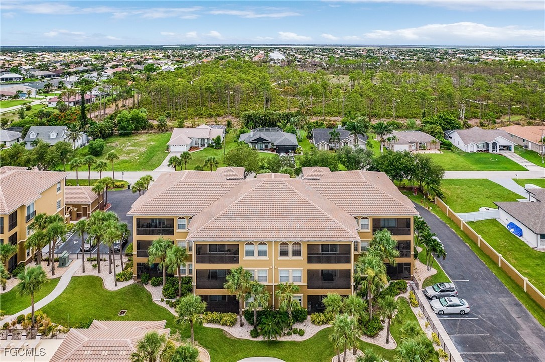 3728 Agualinda Boulevard, Unit 304 Cape Coral, FL 33914 - Photo 24 of 25 an aerial view of multiple house