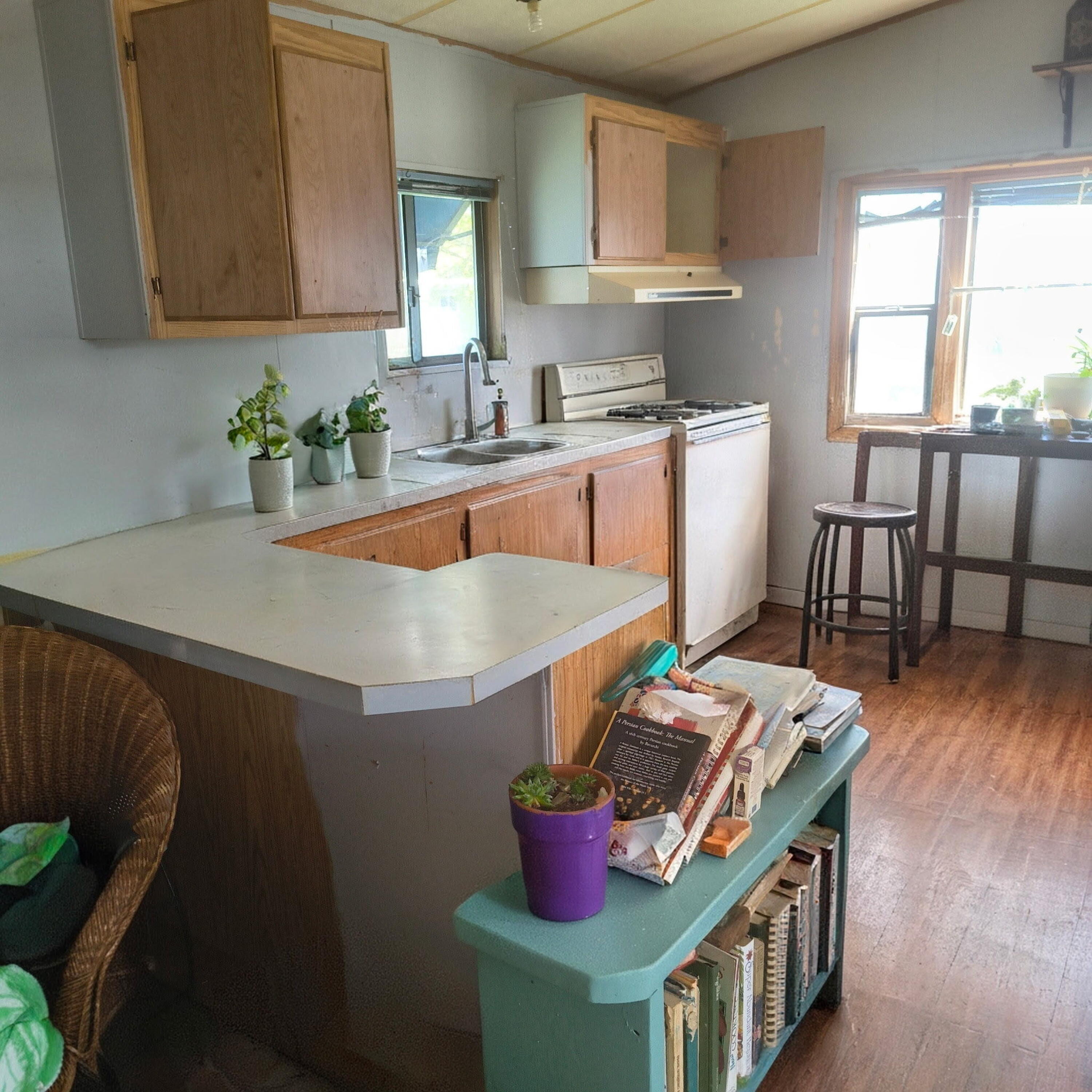 222 Ollis Road, Unit 24 Cave Junction, OR 97523 - Photo 3 of 6 a kitchen with a table and chairs