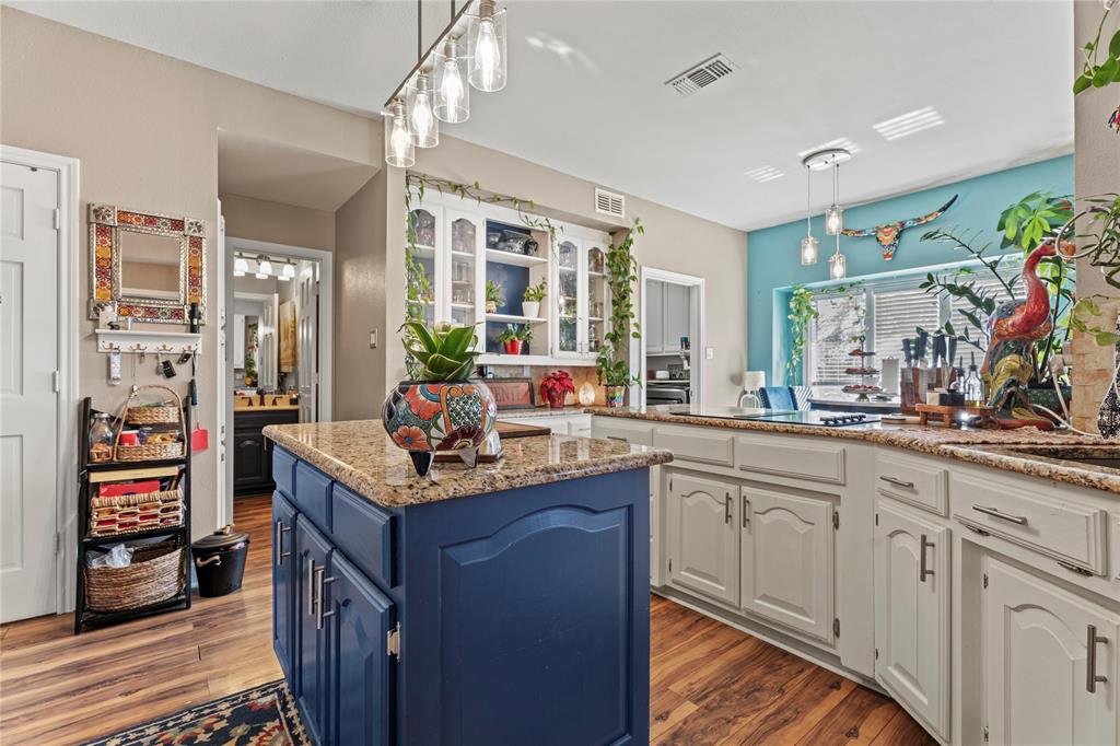 3910 Kingsferry Court Arlington, TX 76016 - Photo 11 of 32 a kitchen with granite countertop a sink stove and cabinets