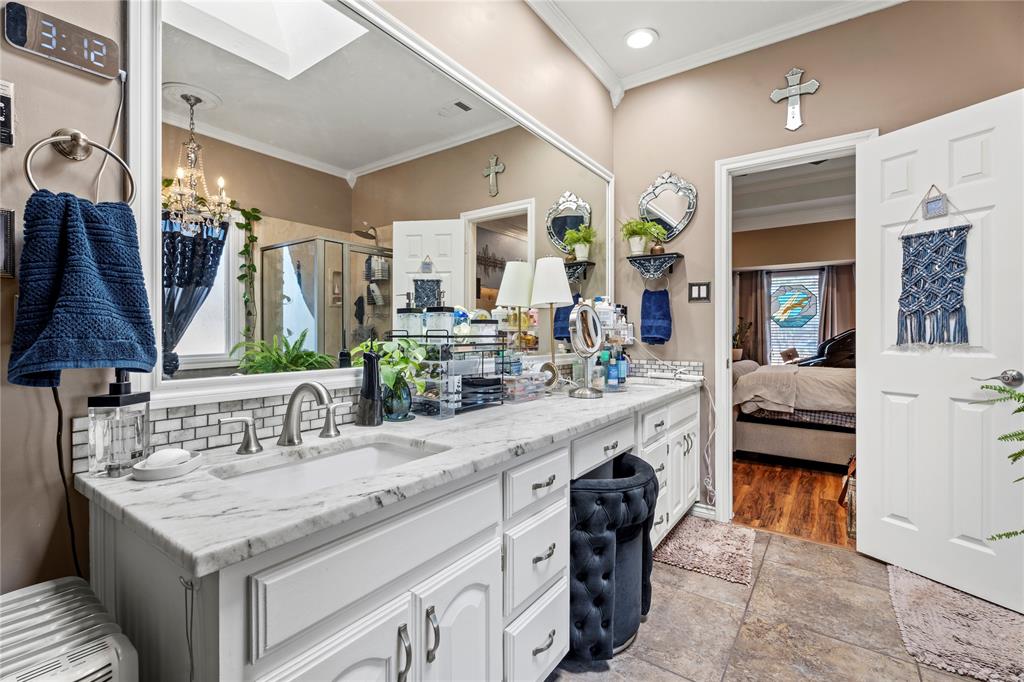 3910 Kingsferry Court Arlington, TX 76016 - Photo 14 of 32 a kitchen with a sink and a refrigerator