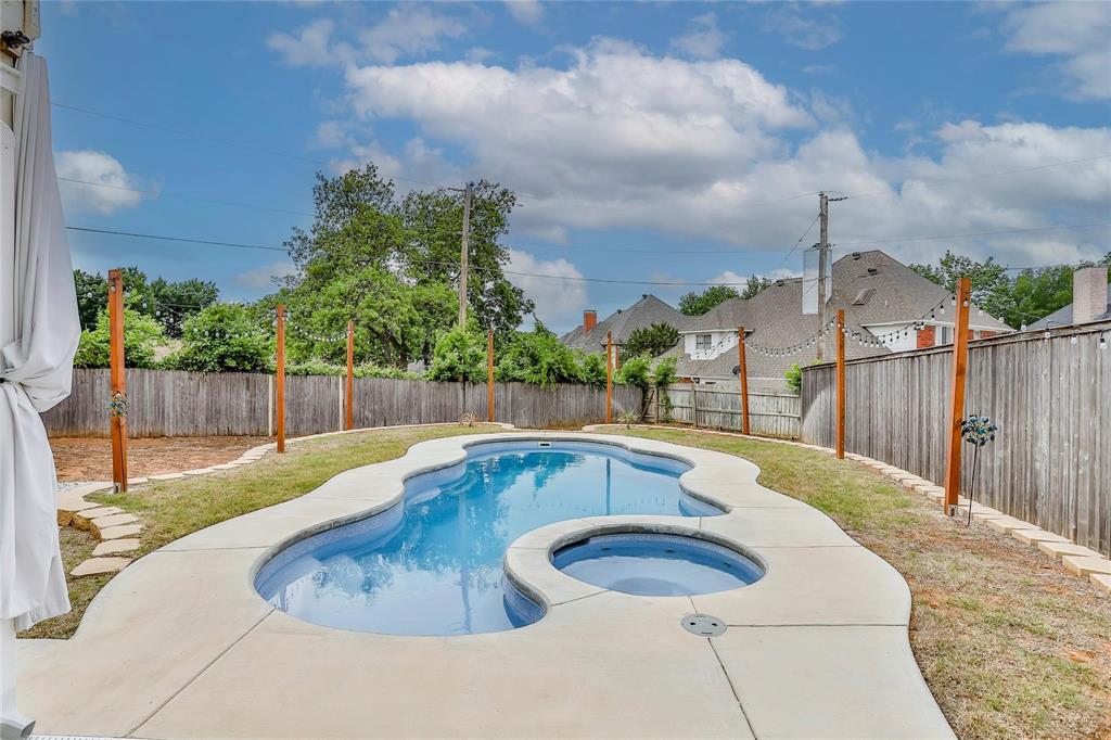 3910 Kingsferry Court Arlington, TX 76016 - Photo 26 of 32 a view of a swimming pool with a patio