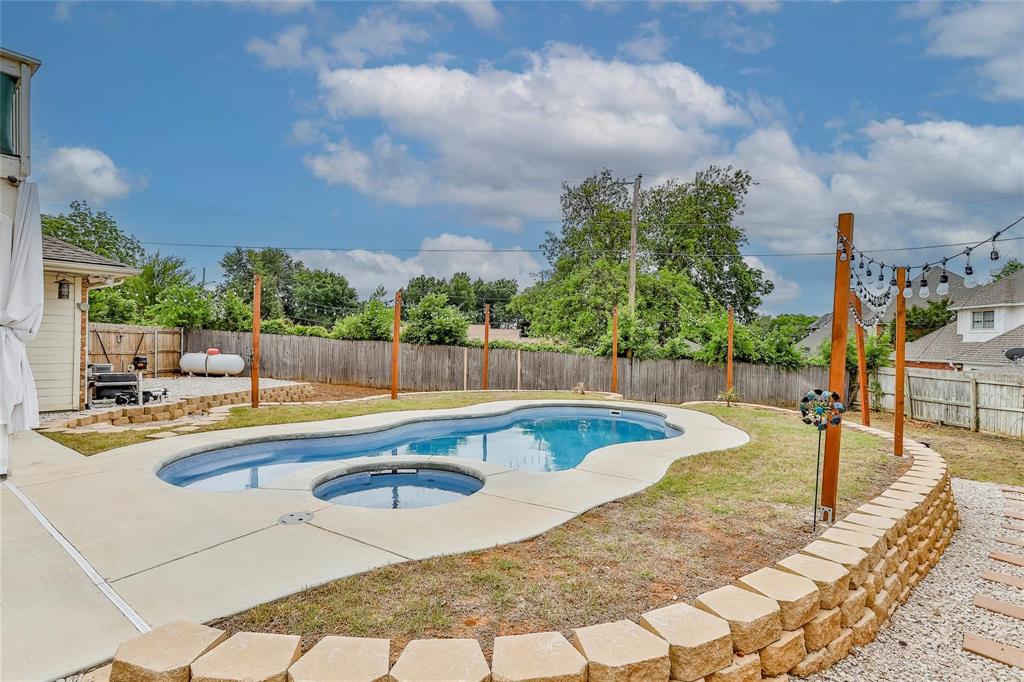 3910 Kingsferry Court Arlington, TX 76016 - Photo 27 of 32 a view of a swimming pool with a lounge chair