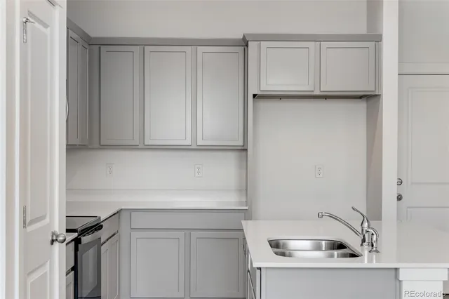 a bathroom with a sink and cabinets