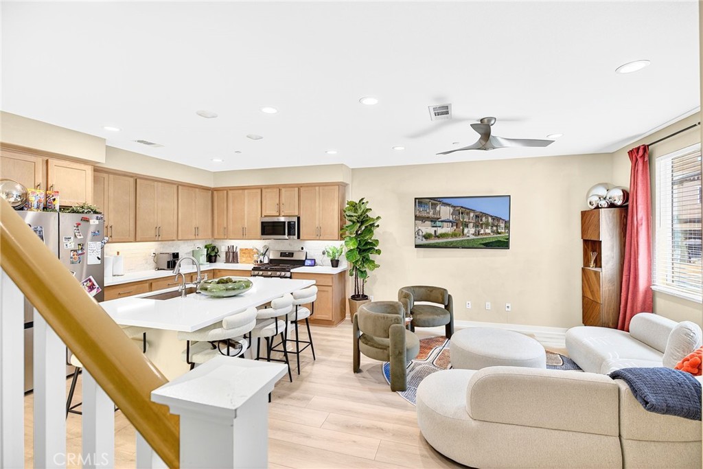 39400 Corvina Lane Temecula, CA 92591 - Photo 20 of 42 a living room with furniture and a wooden floor
