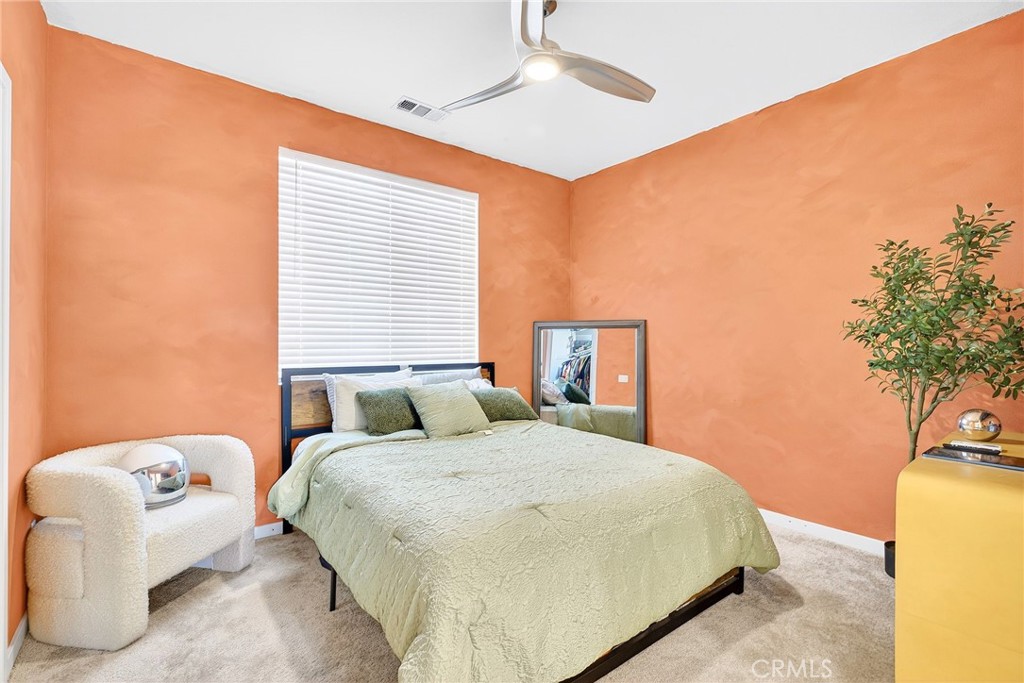 39400 Corvina Lane Temecula, CA 92591 - Photo 25 of 42 a bedroom with a bed and a chandelier