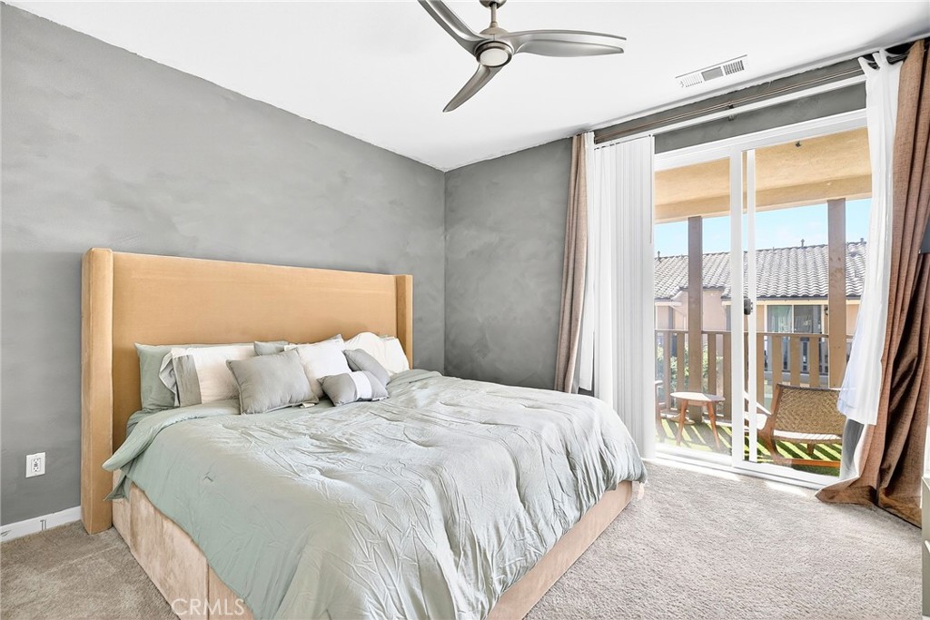 39400 Corvina Lane Temecula, CA 92591 - Photo 28 of 42 a bedroom with a bed and a large window