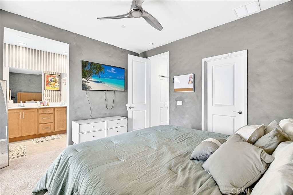 39400 Corvina Lane Temecula, CA 92591 - Photo 29 of 42 a bedroom with a large bed and a flat screen tv