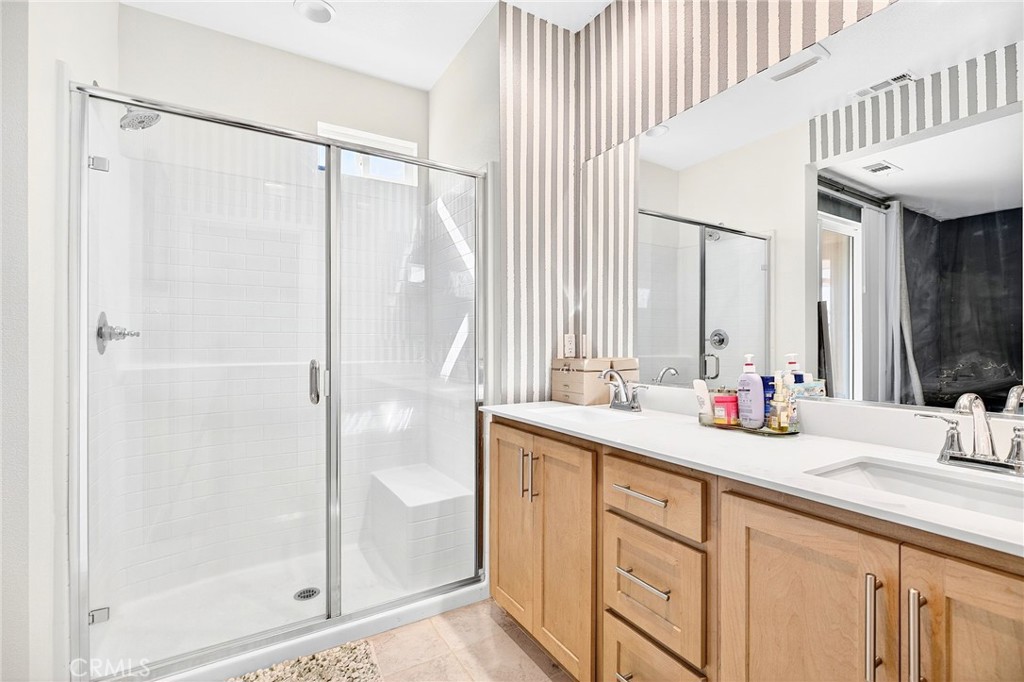 39400 Corvina Lane Temecula, CA 92591 - Photo 31 of 42 a bathroom with a double vanity sink and a mirror