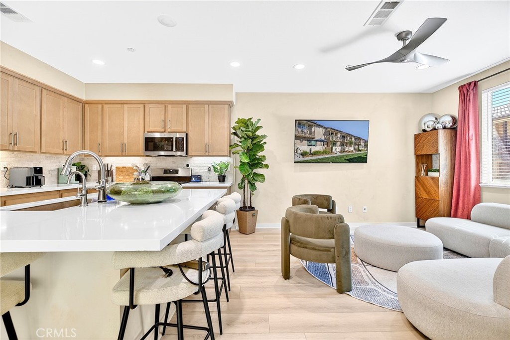 39400 Corvina Lane Temecula, CA 92591 - Photo 8 of 42 a living room with furniture a window and a sink