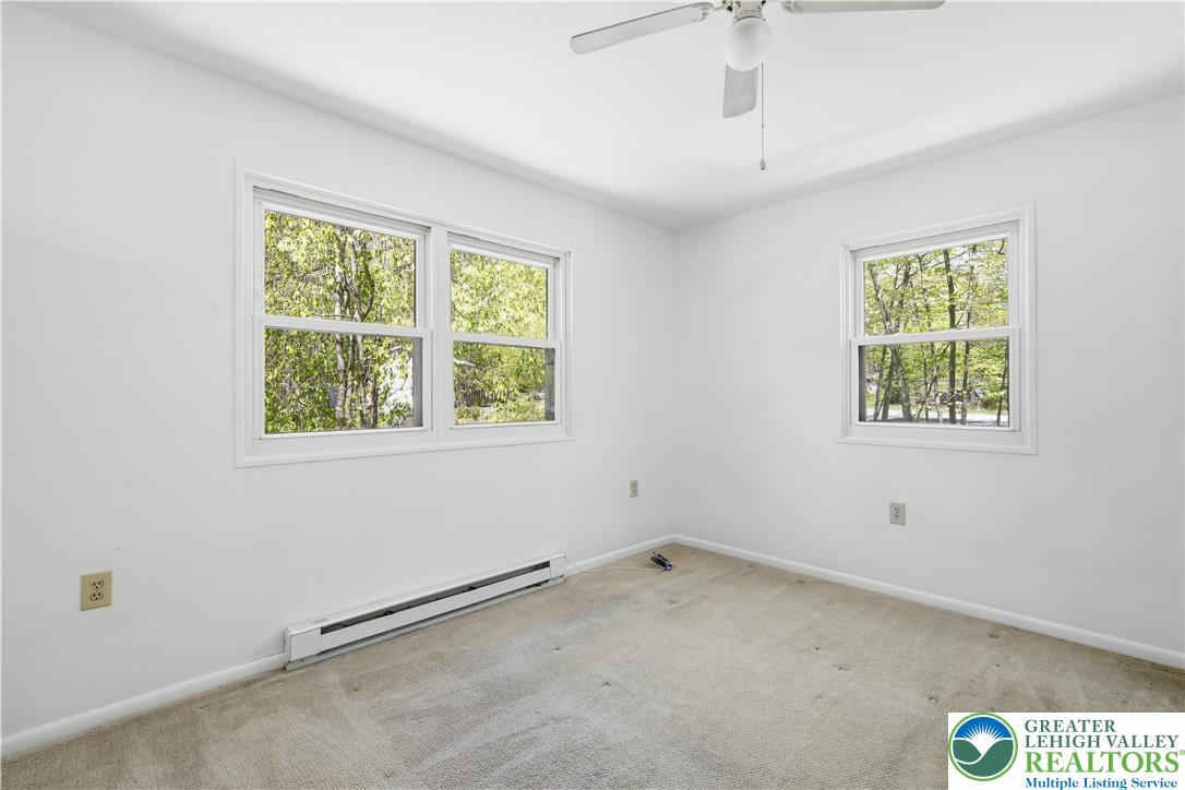 505 Chipmunk Road Bushkill, PA 18324 - Photo 17 of 46 an empty room with windows