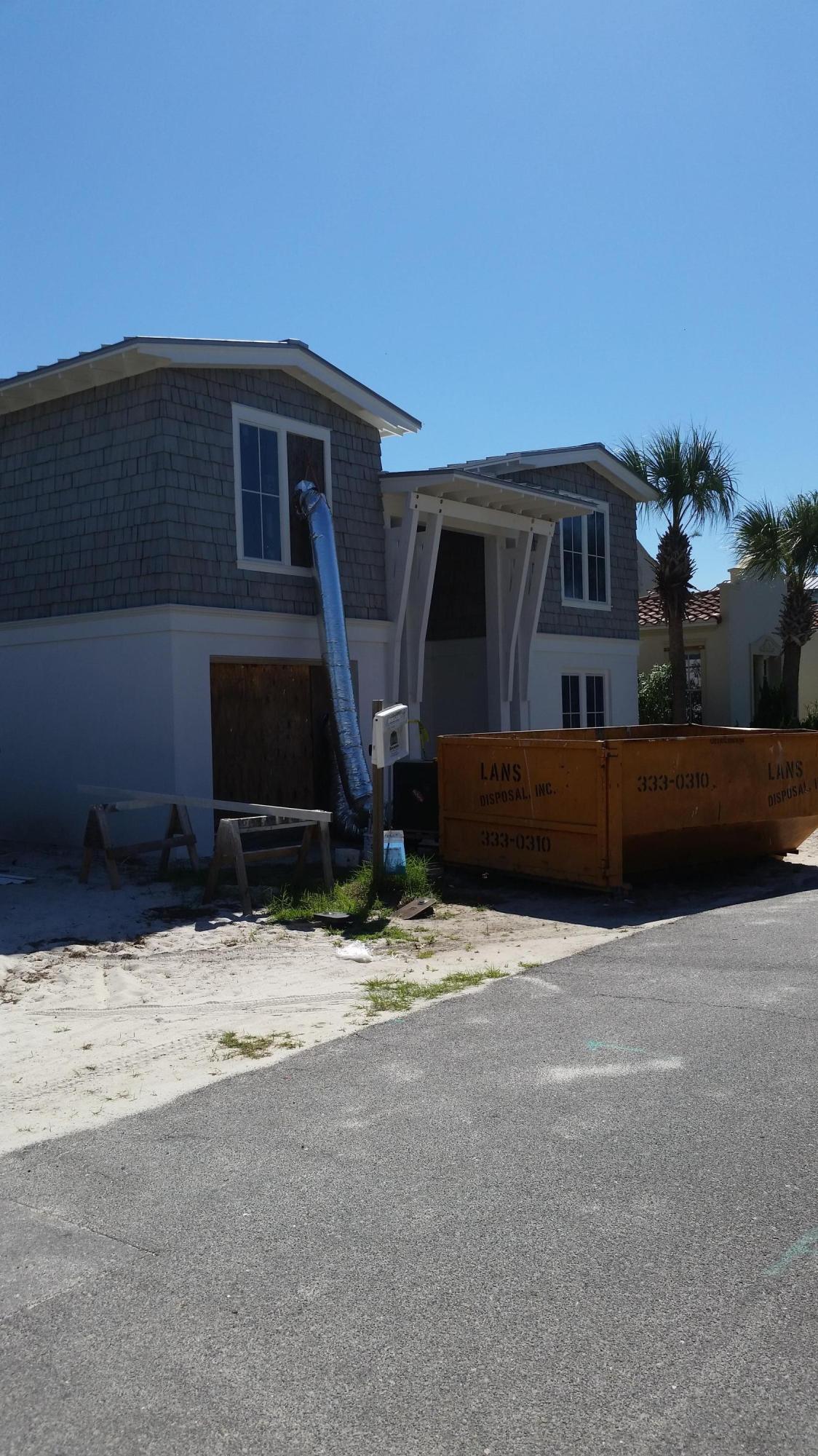 Lot 5 Sand Cliffs Dr Inlet Beach Inlet Beach, FL 32461 - Photo 10 of 10 a front view of a house with a yard