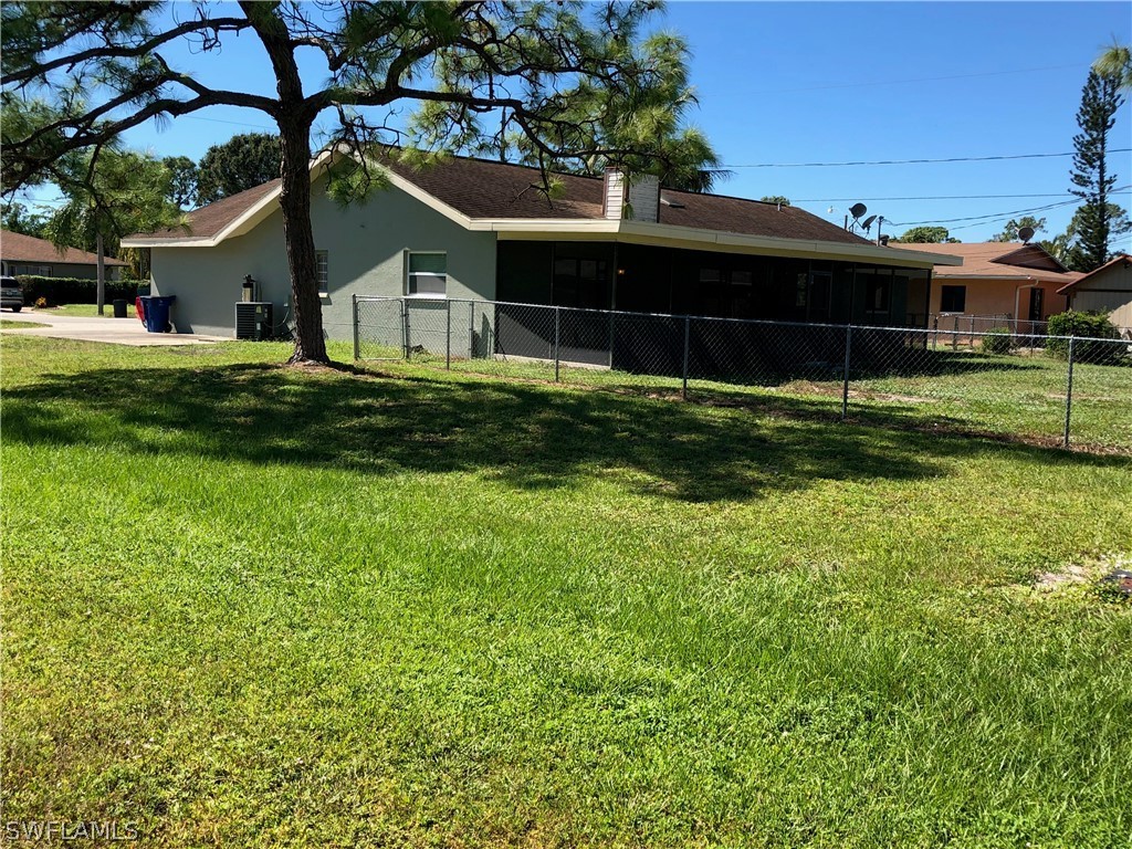 7535 Morgan Road Fort Myers, FL 33967 - Photo 18 of 19 a front view of a house with a yard