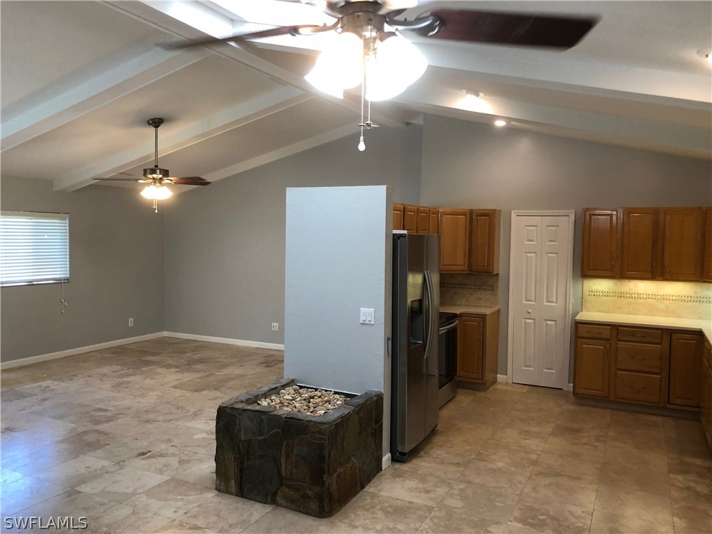 7535 Morgan Road Fort Myers, FL 33967 - Photo 4 of 19 a kitchen with refrigerator and cabinets