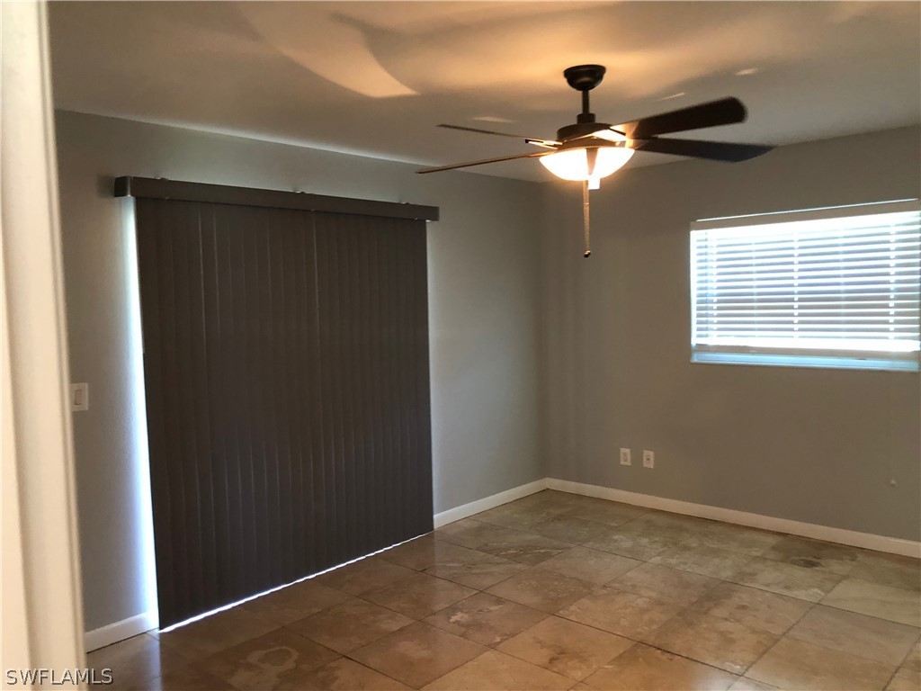 7535 Morgan Road Fort Myers, FL 33967 - Photo 8 of 19 a view of empty room with window and ceiling fan