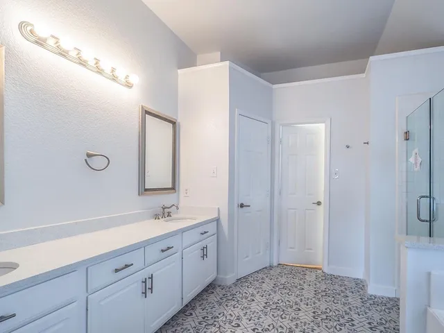 a bathroom with a bathtub and a shower