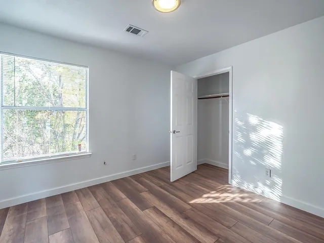 a bathroom with a double vanity sink mirror and toilet