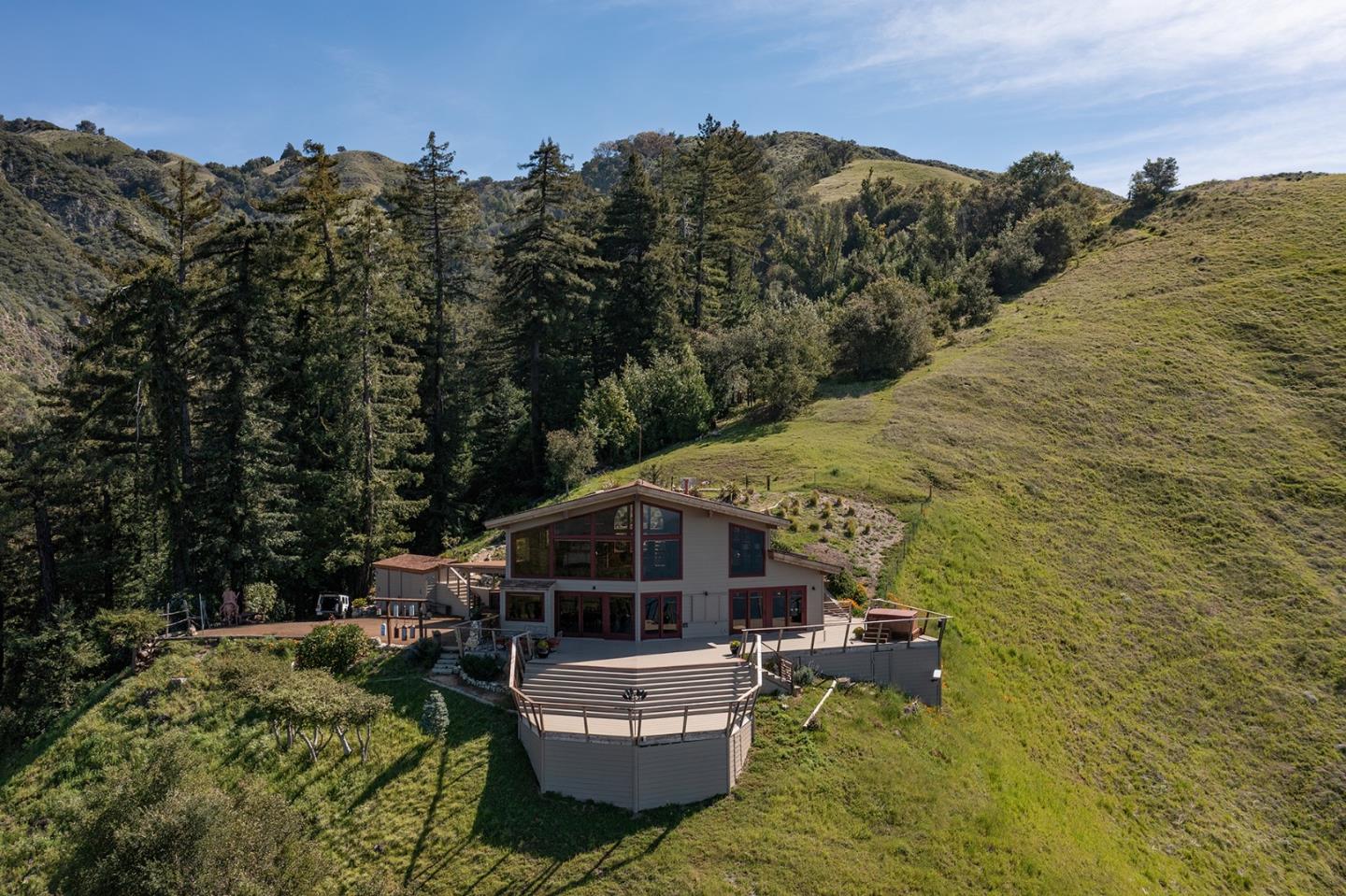 47600 Coast Ridge Road Big Sur, CA 93920 - Photo 32 of 36 a view of a house with a yard