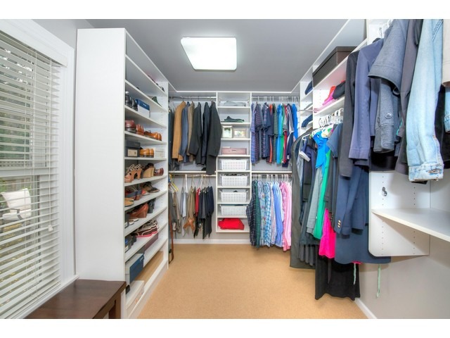764 Locust Street Winnetka, IL 60093 - Photo 13 of 25 a view of walk in closet with clothes and shoes