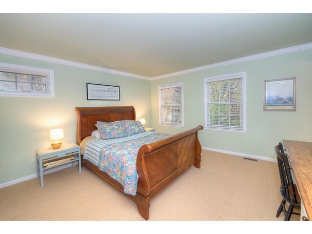 764 Locust Street Winnetka, IL 60093 - Photo 14 of 25 a bed room with a bed and a chair