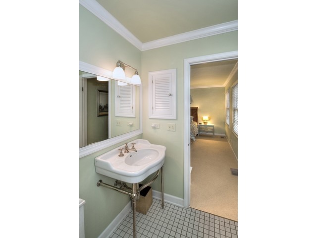764 Locust Street Winnetka, IL 60093 - Photo 17 of 25 a bathroom with a sink and a mirror
