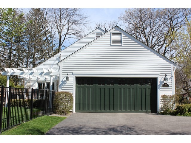 764 Locust Street Winnetka, IL 60093 - Photo 24 of 25 a front view of a house with a garden