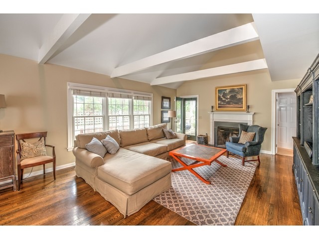 764 Locust Street Winnetka, IL 60093 - Photo 3 of 25 a living room with furniture fireplace and a table