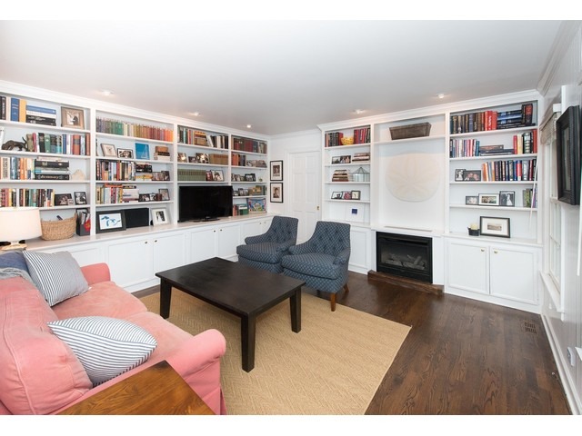 764 Locust Street Winnetka, IL 60093 - Photo 8 of 25 a living room with furniture a rug and a bookshelf