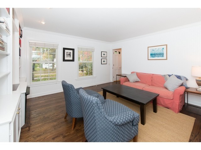 764 Locust Street Winnetka, IL 60093 - Photo 9 of 25 a living room with furniture and a wooden floor