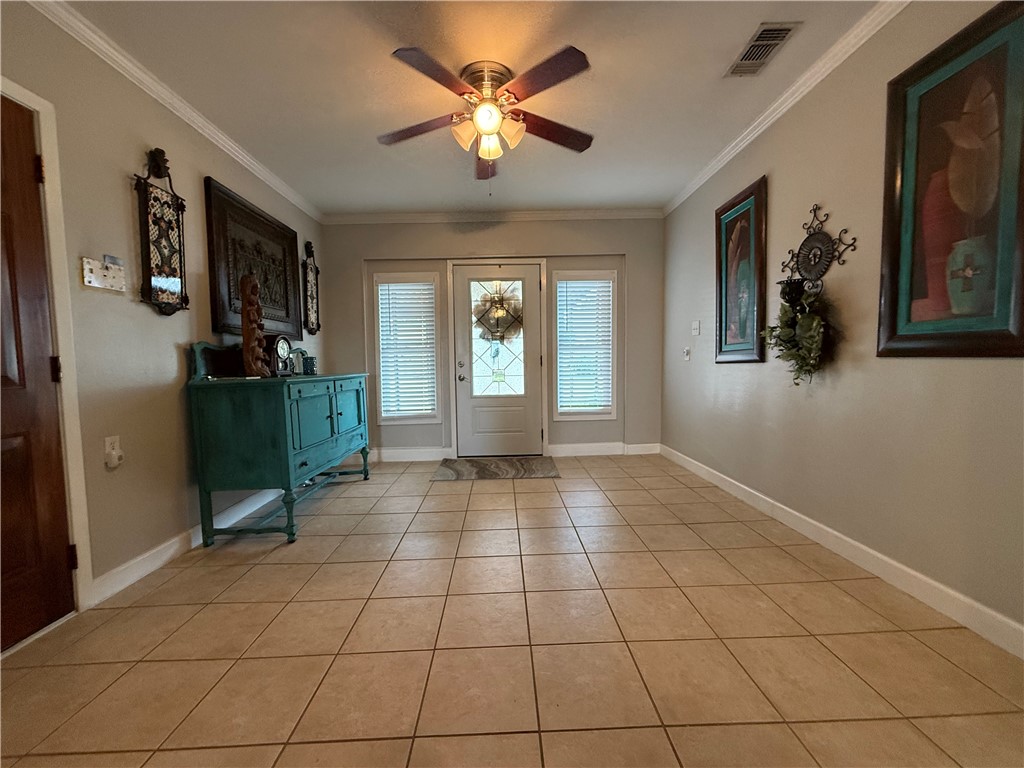 116 Sunset Drive Mathis, TX 78368 - Photo 11 of 40 a view of an empty room with window and cabinet
