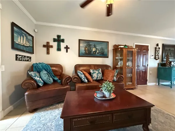 a living room with furniture and flat screen tv