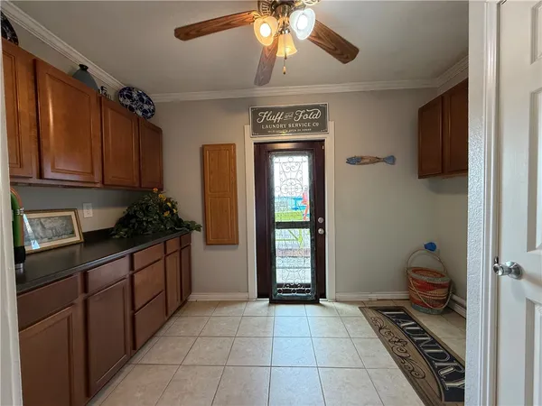 a kitchen with a refrigerator and cabinets